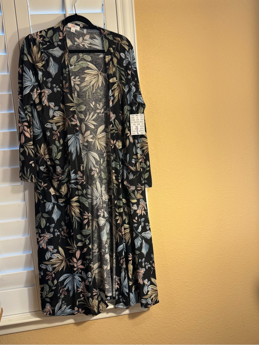 LuLaRoe black floral print skirt with blue, cream and brown leaves Sarah